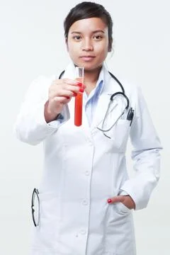 A chemist holding a flask Stock Photos