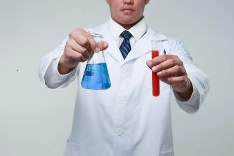 A chemist holding a flask Stock Photos