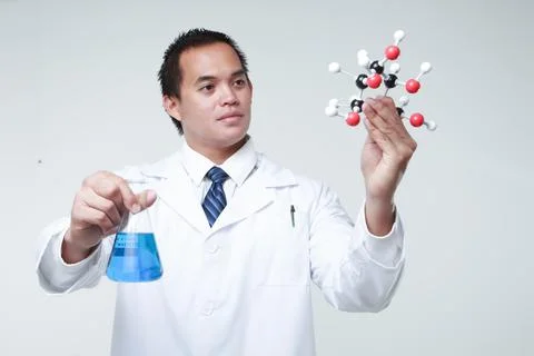 A chemist holding a flask Stock-Fotos