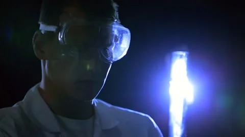 Chemist holds experience and injects a substance in a test tube Stock Footage 48055227