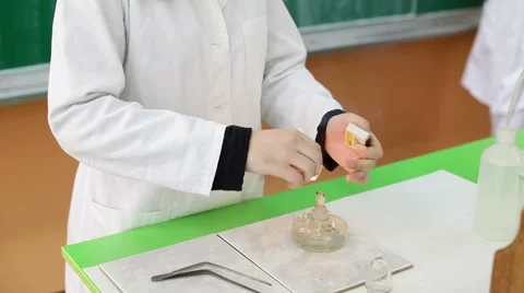 Chemist light a fire with matches to perform an experiment in a laboratory Stock Footage 55294320