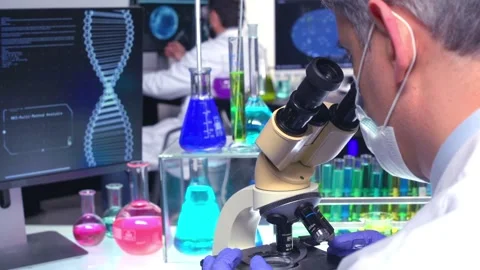 Chemist Looking through Microscope Vidéo 202147379