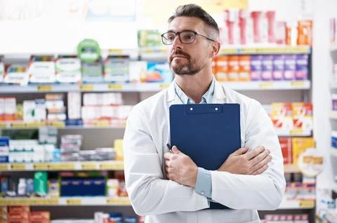 Chemist, man and thinking in pharmacy with clipboard, quality assurance and.. Stock Photos