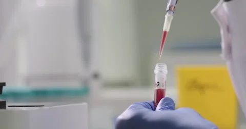 Chemist or scientist holds liquid sample. Scientific laboratory of biotechnology Stock Footage 268687823