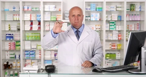 Chemist Present Best Vitamins with Ok Hand Gesture in a Drugstore Advertisement Stock Footage 75743833