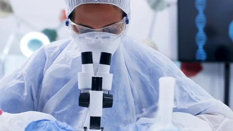 Chemist scientist doing lab research using a modern microscope Stock Footage 114508085