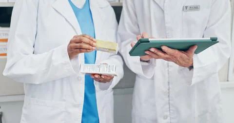Chemist, team and hands in pharmacy with tablet, check medicine and verify with Stock Photos