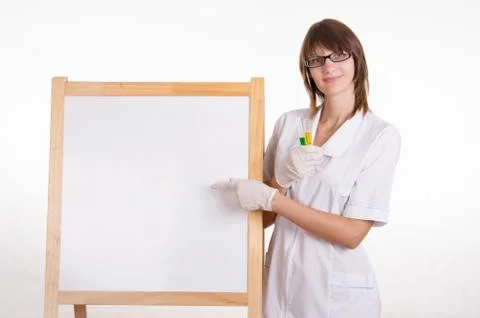 Chemist with test tubes at the board Stock Photos