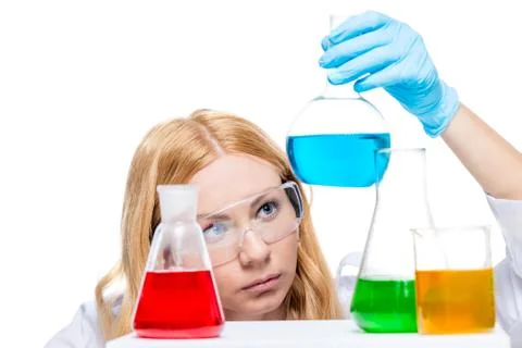 Chemist with test tubes on the table does chemical analysis Stock Photos