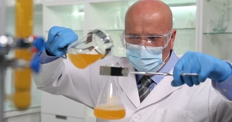 Chemist Work in Laboratory Make a Sciences Experiment Mixing Chemical  Liquids Stock Footage 83687940