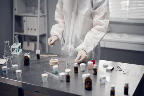 Chemist working in a modern laboratory. Close-up of a person studying a chemical Stock Photos
