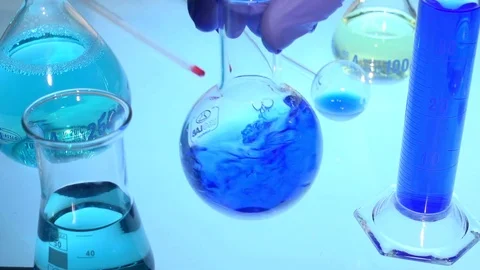 Chemistry flask mixing Stock Footage 73692186