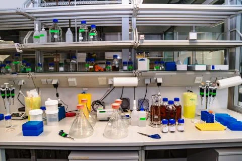 Chemistry lab with different flasks and containers Stock Photos