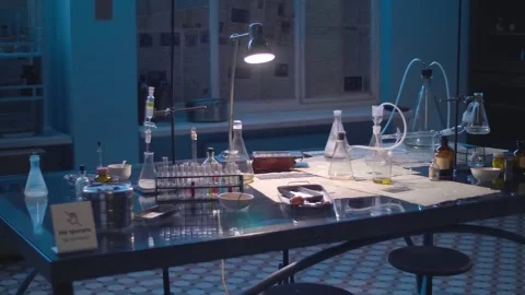 Chemistry lab with lots of beakers, test tubes, flasks, spirit lamps, chemicals Stock Footage 323967397
