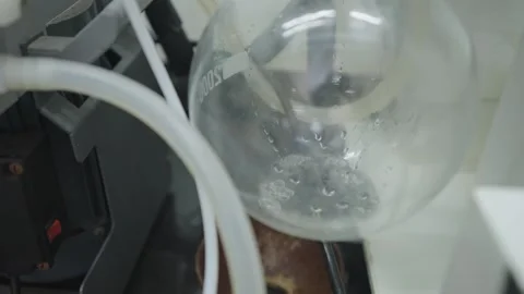 Chemistry Laboratory Glass Beaker in process of heating the Chemical in Scie Stock Footage 322150751