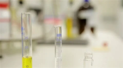 Chemistry measuring glasses set up for experiments Stock Footage 60698291