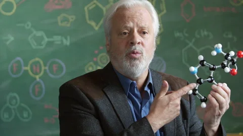 A Chemistry professor with a model of a molecule Stock Footage