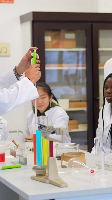 Chemistry teacher performing experiment for students Stock Footage 302819046