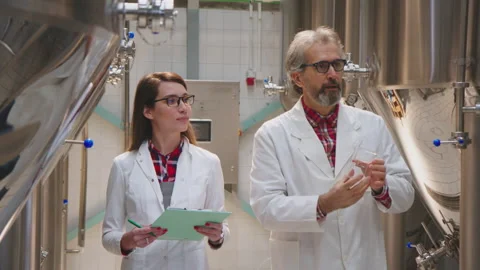Chemists working in a brewery Stock Footage 147352794