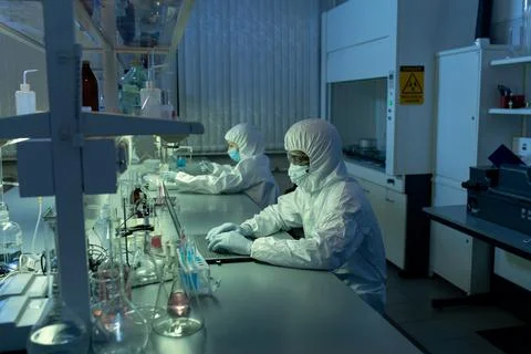 Chemists working on computers in the lab 스톡 사진