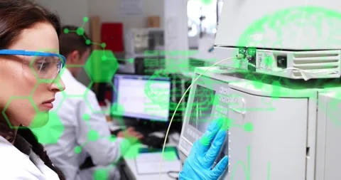 Chemists working in a laboratory on a computer Stock Footage 329579861