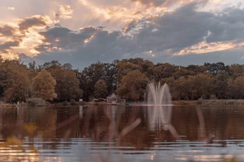 Chemnitz lake, moving clouds over Castle Park with fountain,schlossteich Stock Photos