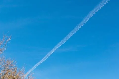 Chemtrails or Contrials in the sky Stock Photos