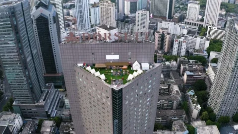 Chengdu Forward Drone Flight Past Triangular High Rise and Branded Towers Stock Footage 327558139