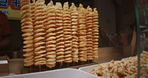 Chengdu, Sichuan, China. Stack Of Fried Spiral Potato Chips, Curly Fries On Stock Footage 300915818