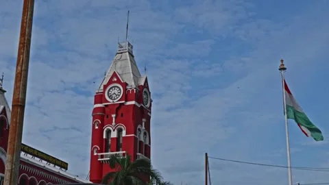 Chennai central with clock tower, indian flag and flying birds at periamet Vídeos de archivo 300553035