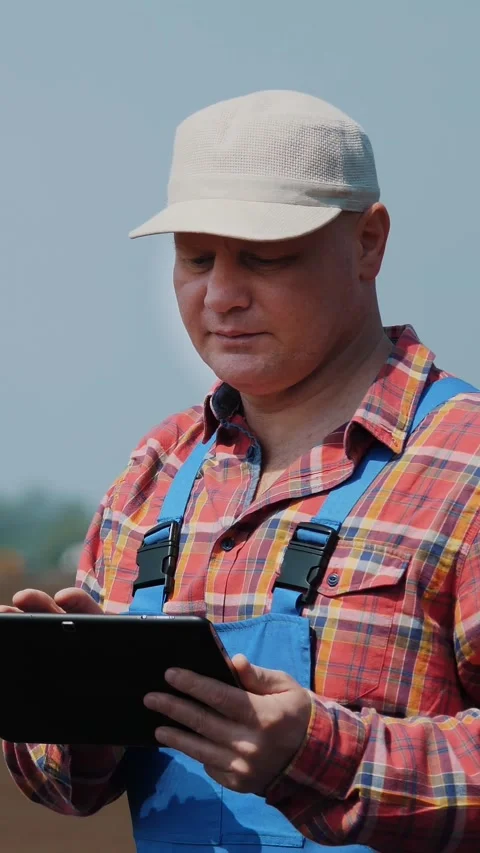 CHERKASY, UKRAINE, APRIL 28, 2020: Farmer, agronomist stands on farm field, Stock Footage 314660341