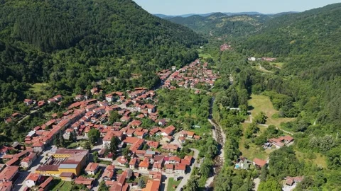 Cherni Osam pull out drone flight over river valley Bulgaria Stock Footage 343914477
