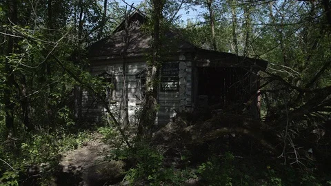 Chernobyl Exclusion Zone. Abandoned post office in Krasnoe Village. Wide Dolly Stock Footage 128667378