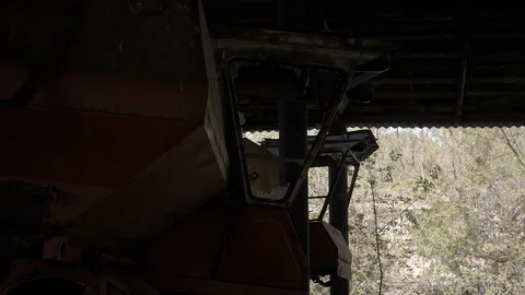 Chernobyl Exclusion Zone. Rusty Harvesters In An Abandoned Zymovyshche Kolkhoz Stock Footage 128664036