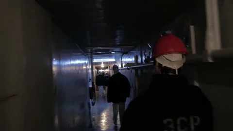 Chernobyl workers walk along the corridor to work Stock-Footage 194709091