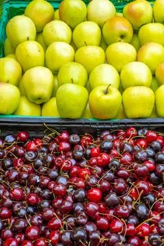 Cherries and apples Stock Photos