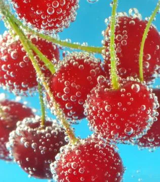 Cherries and bubbles Stock Photos