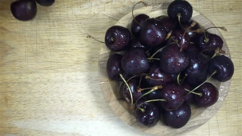 Cherries are falling in slow motion next to berries Stock Footage 135728018