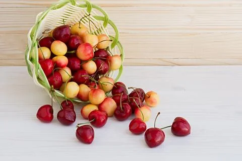 Cherries in a basket on the table. Stock Photos
