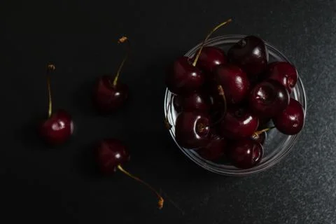 Cherries on black table Stock Photos