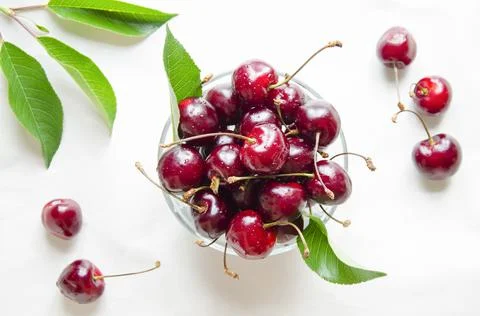 Cherries in the center of the frame, on a light background. Stock Photos