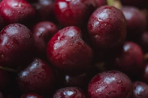 Cherries. Cherry background. Fruit background. Wet cherry with leaves Foto stock