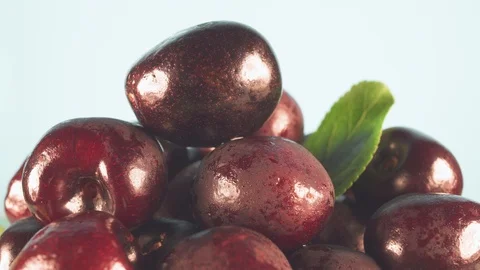 Cherries close-up rotate in front of the camera. Lots of cherries. Video stock 112057469