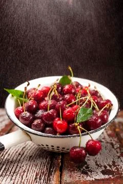 Cherries in colander Stock Photos
