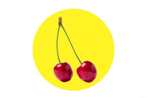Cherries on a creative background. Ripe cherries on a yellow circle background.  Stock Photos