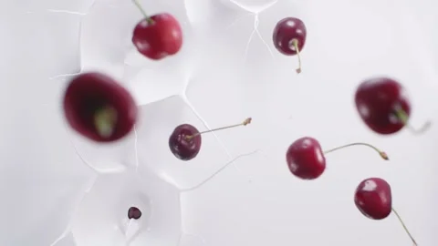 Cherries falling down to the milk Stock Footage 171887868