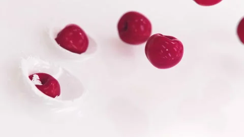 Cherries Falling Into Milk in 4K Super slow motion Stock Footage 141029204
