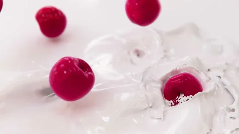 Cherries Falling Into Milk in 4K Super slow motion Stock-Footage 141029235