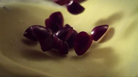 Cherries falling on the pastry Stock Footage 256936944