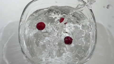 Cherries falling into water in slow motion Stock Footage 77002437